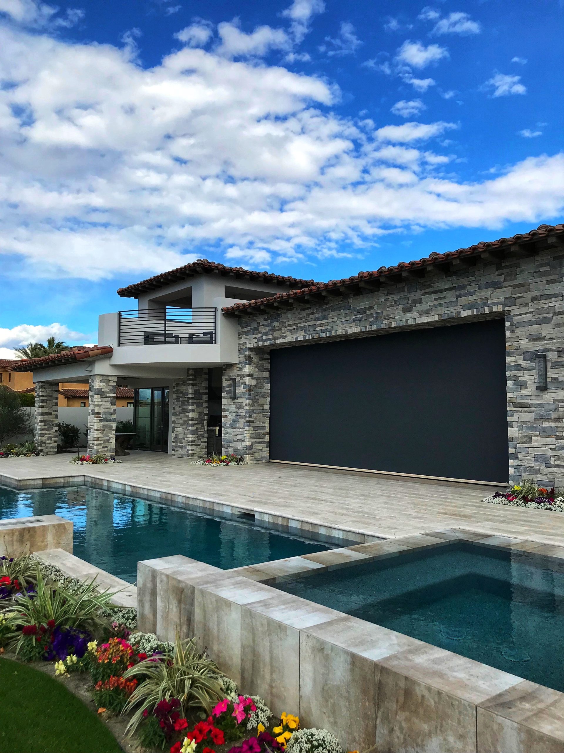 Motorized screen on a residential garage